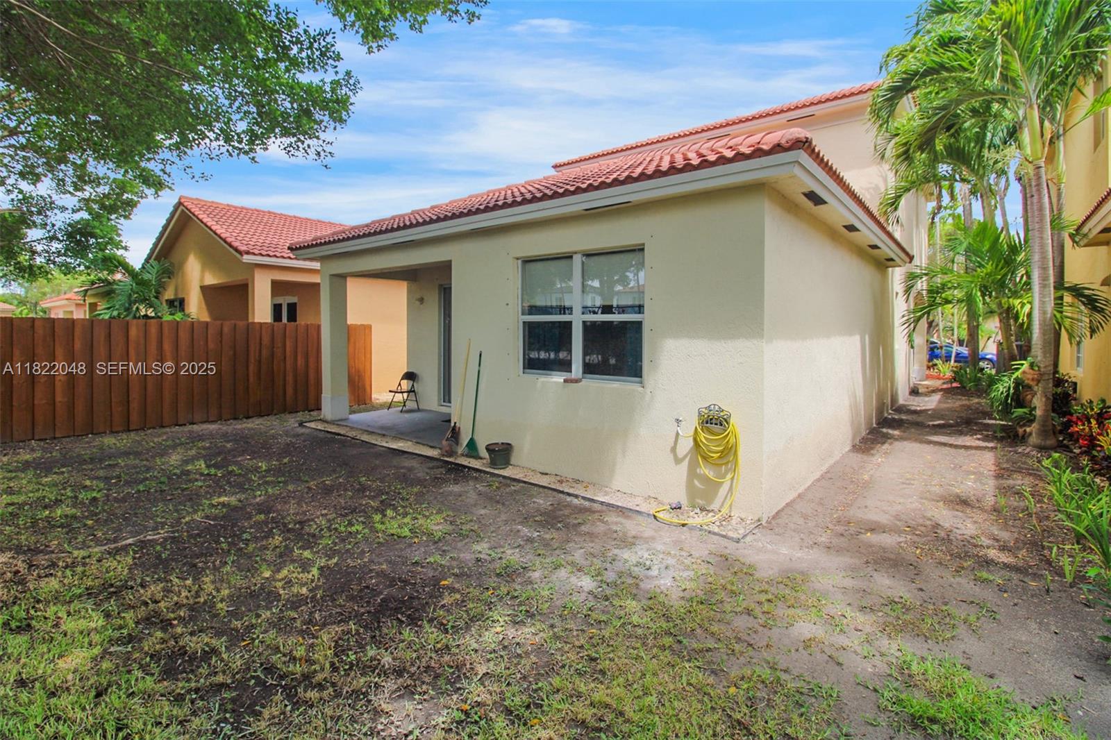 2131 Northeast 37th Road Homestead, FL 33033 - Photo 30 of 34 a view of a house with backyard and a tree