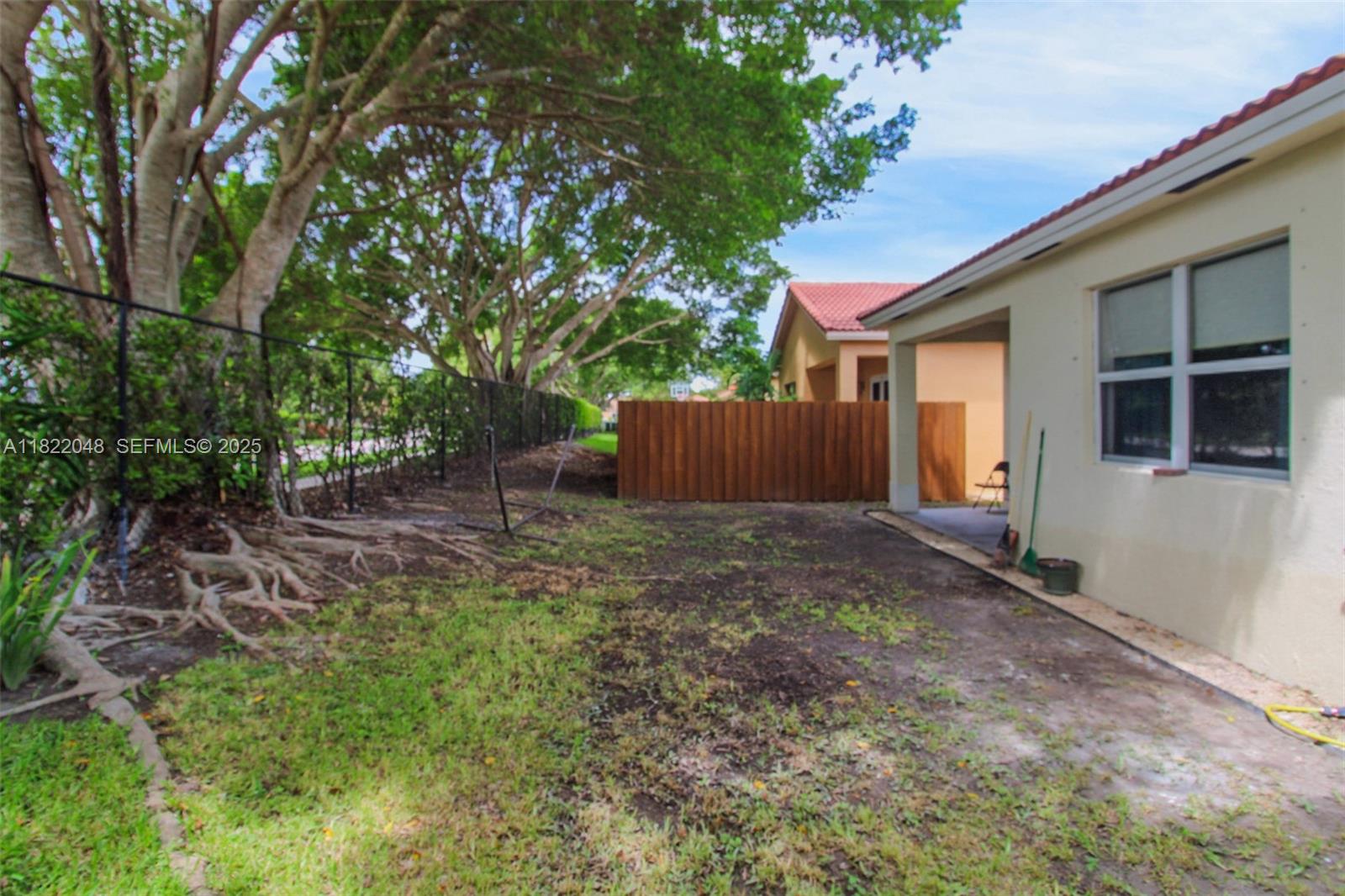 2131 Northeast 37th Road Homestead, FL 33033 - Photo 31 of 34 a backyard of a house with lots of green space