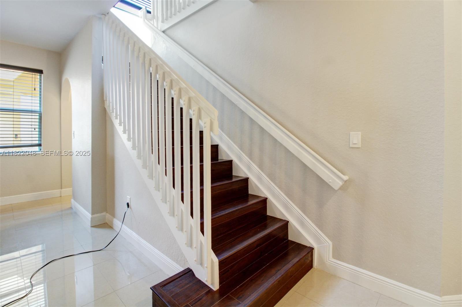 2131 Northeast 37th Road Homestead, FL 33033 - Photo 7 of 34 a view of entryway and hall with wooden floor