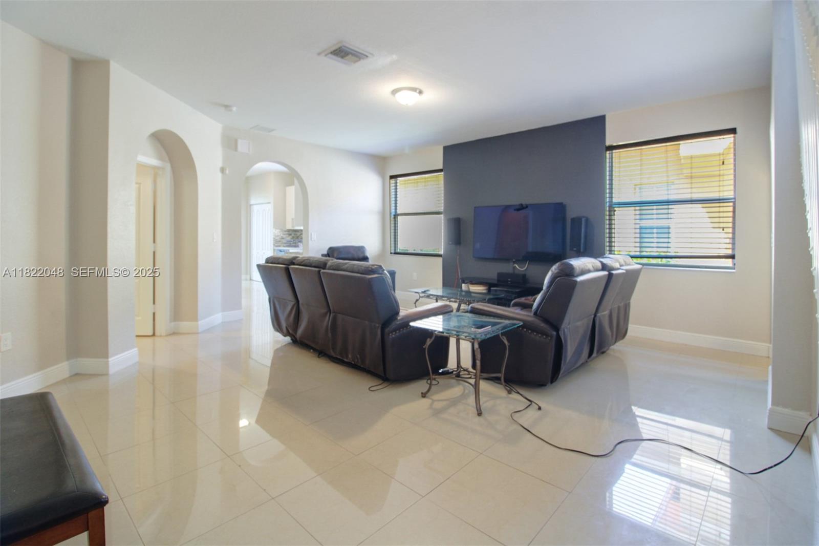 2131 Northeast 37th Road Homestead, FL 33033 - Photo 8 of 34 a living room with furniture and a large window