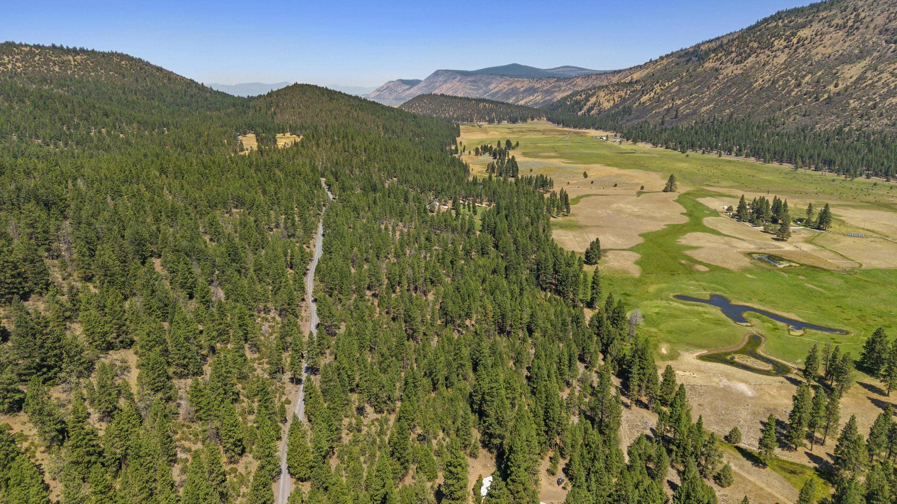 0 Simpson Canyon Road, Unit 15 Klamath Falls, OR 97601 - Photo 29 of 37 a view of a lush green hillside and houses