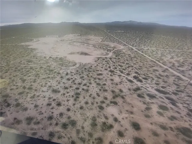 a view of a dry yard with wooden floor