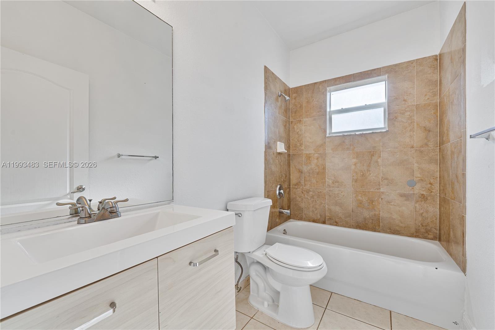 10357 Southwest 178th Street, Unit 10357 Miami, FL 33157 - Photo 17 of 25 a bathroom with a sink a toilet and shower