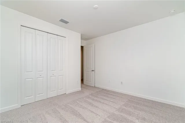 a spacious bathroom with a double vanity sink and a mirror