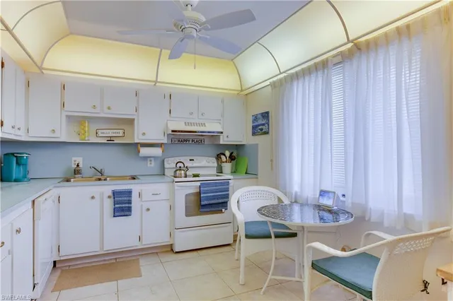 a kitchen with stainless steel appliances granite countertop a sink and cabinets