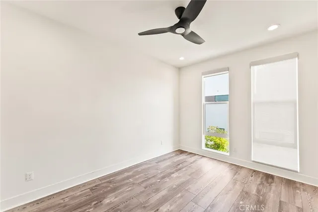 an empty room with window and stairs