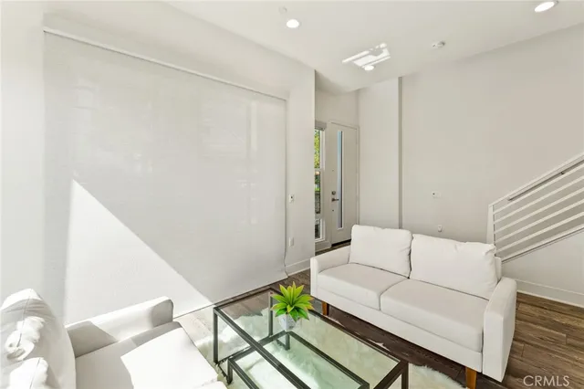 a living room with furniture and a rug