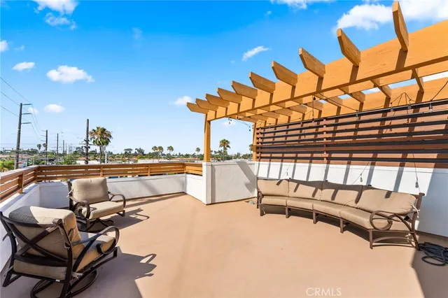 a view of swimming pool with outdoor seating