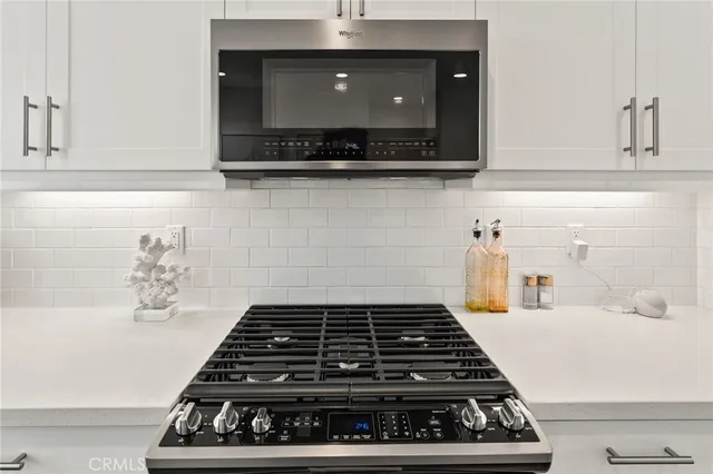 a kitchen with a stove and a microwave
