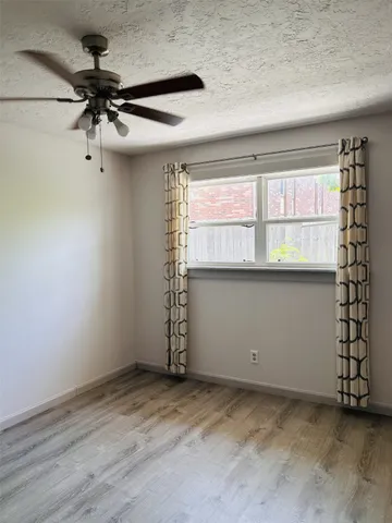 an empty room with a empty space and windows