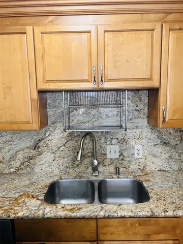 a view of a sink and a window