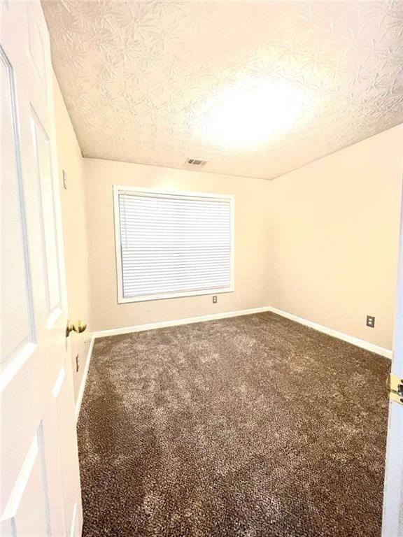 3854 Austin Park Lane Decatur, GA 30032 - Photo 34 of 44 a view of empty room with wooden floor and fan