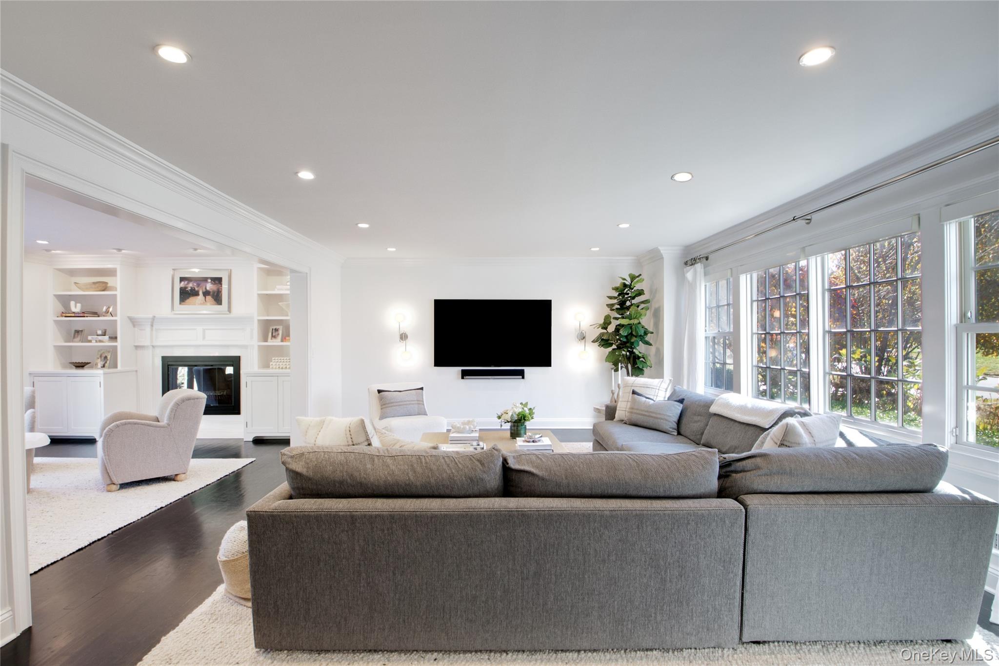 6 Flamingo Road East Hills, NY 11576 - Photo 3 of 37 a living room with furniture and a flat screen tv