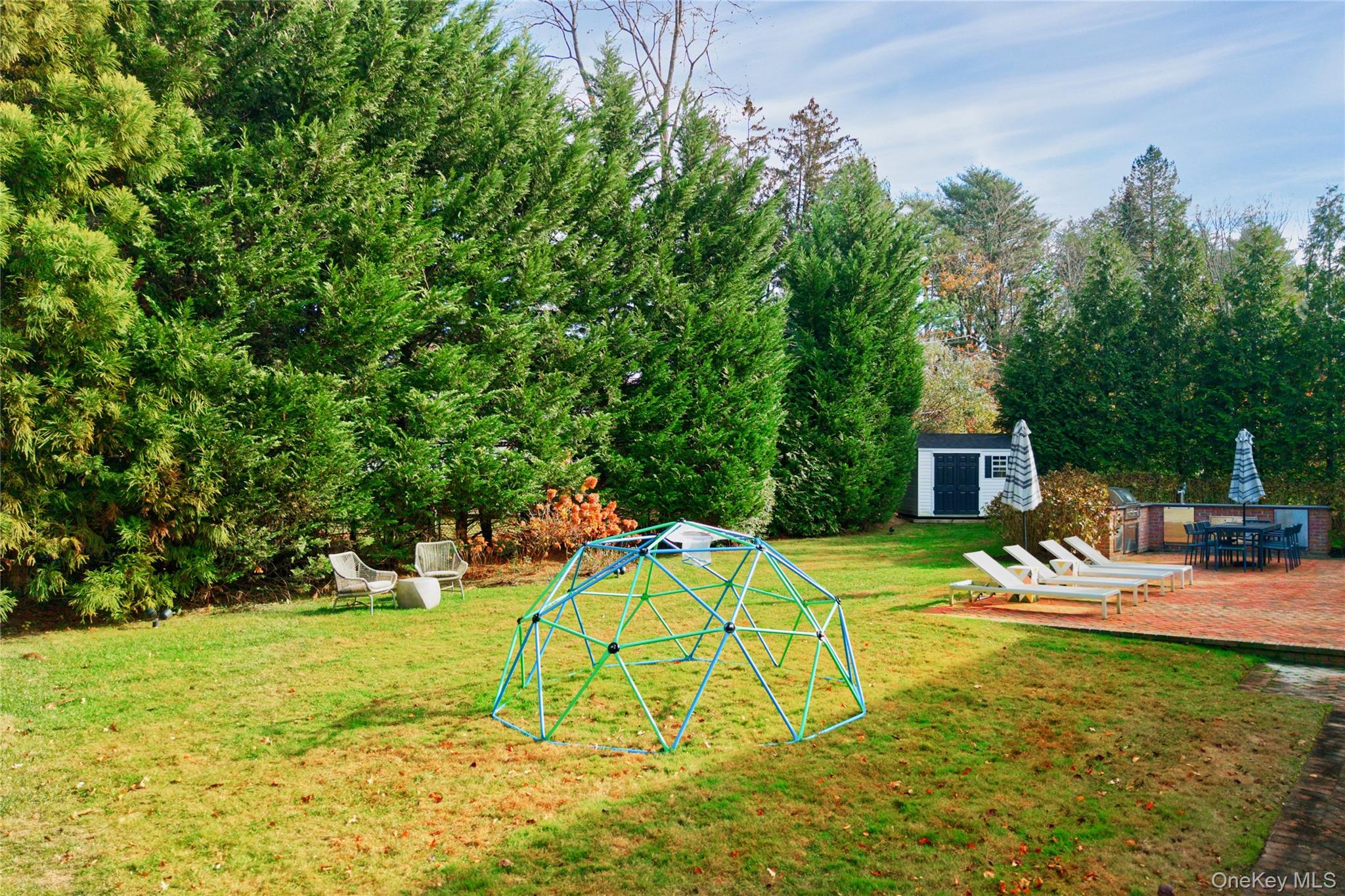 6 Flamingo Road East Hills, NY 11576 - Photo 33 of 37 a view of a backyard with a patio