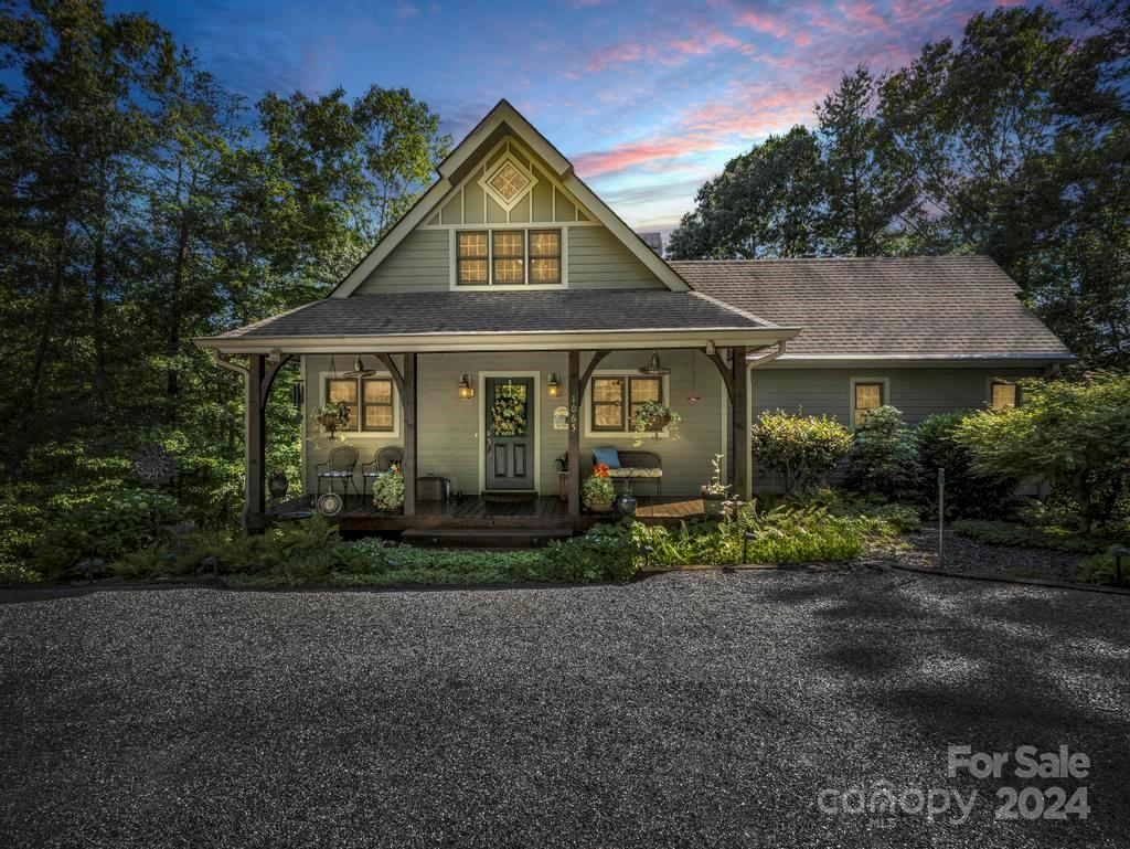 1065 South Cove Road Mill Spring, NC 28756 - Photo 1 of 48 a front view of a house with garden