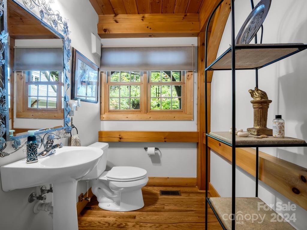 1065 South Cove Road Mill Spring, NC 28756 - Photo 12 of 48 a bathroom with a sink and a mirror