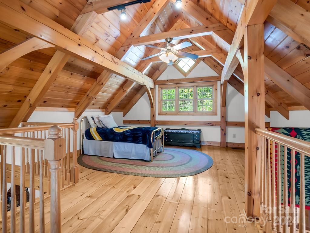 1065 South Cove Road Mill Spring, NC 28756 - Photo 18 of 48 a room with lots of wooden furniture and wooden floor
