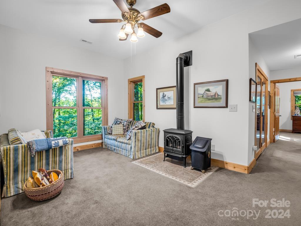 1065 South Cove Road Mill Spring, NC 28756 - Photo 23 of 48 a living room with furniture and a large window