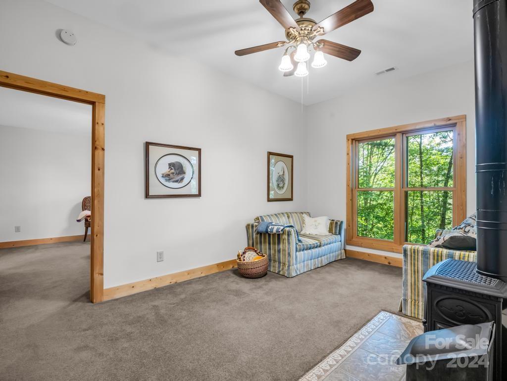 1065 South Cove Road Mill Spring, NC 28756 - Photo 24 of 48 a living room with furniture and a large window