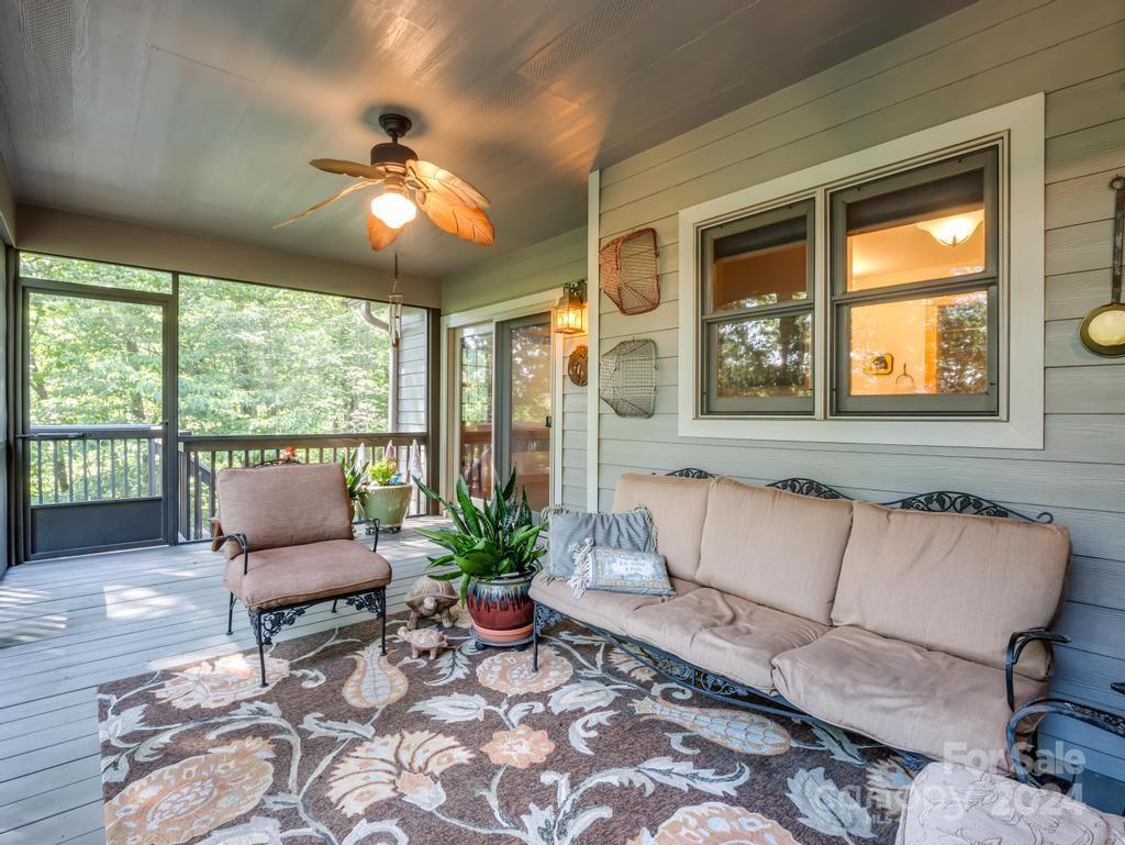 1065 South Cove Road Mill Spring, NC 28756 - Photo 28 of 48 a living room with furniture and a large window