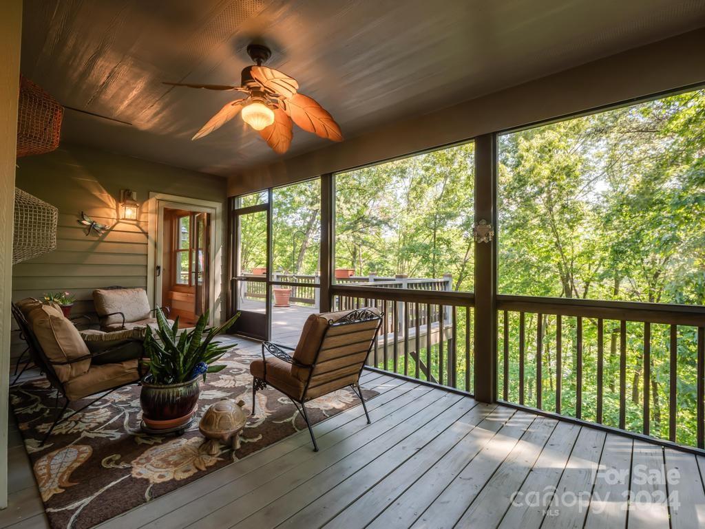 1065 South Cove Road Mill Spring, NC 28756 - Photo 29 of 48 a view of a porch with furniture and wooden floor