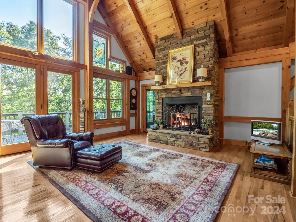 1065 South Cove Road Mill Spring, NC 28756 - Photo 6 of 48 a living room with furniture and a fireplace