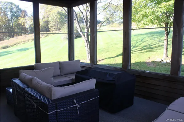 a living room with large windows