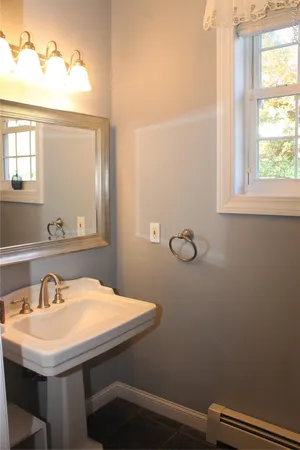 a bathroom with a sink and a window