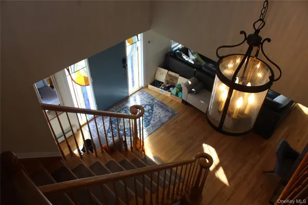 a view of staircase and wooden floor