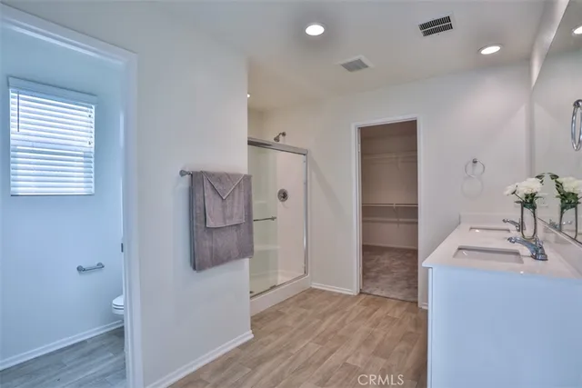 a bathroom with a double vanity sink mirror and double