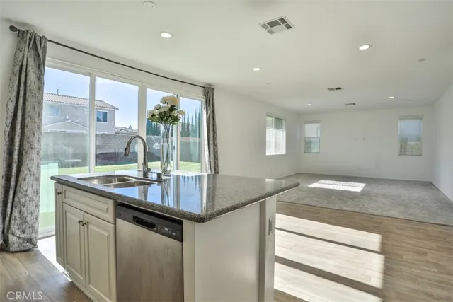 a kitchen with sink and window