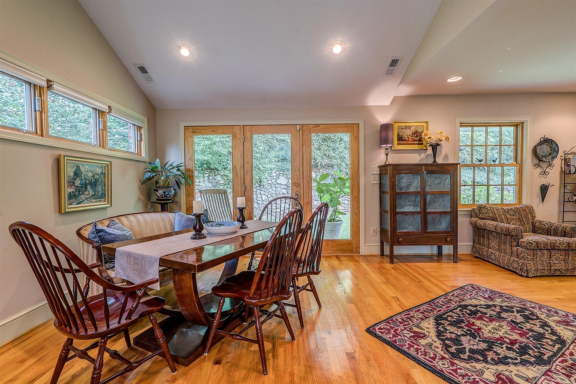3126 Stoneridge Road Southwest Roanoke, VA 24014 - Photo 11 of 48 a view of a dining room with furniture window and wooden floor
