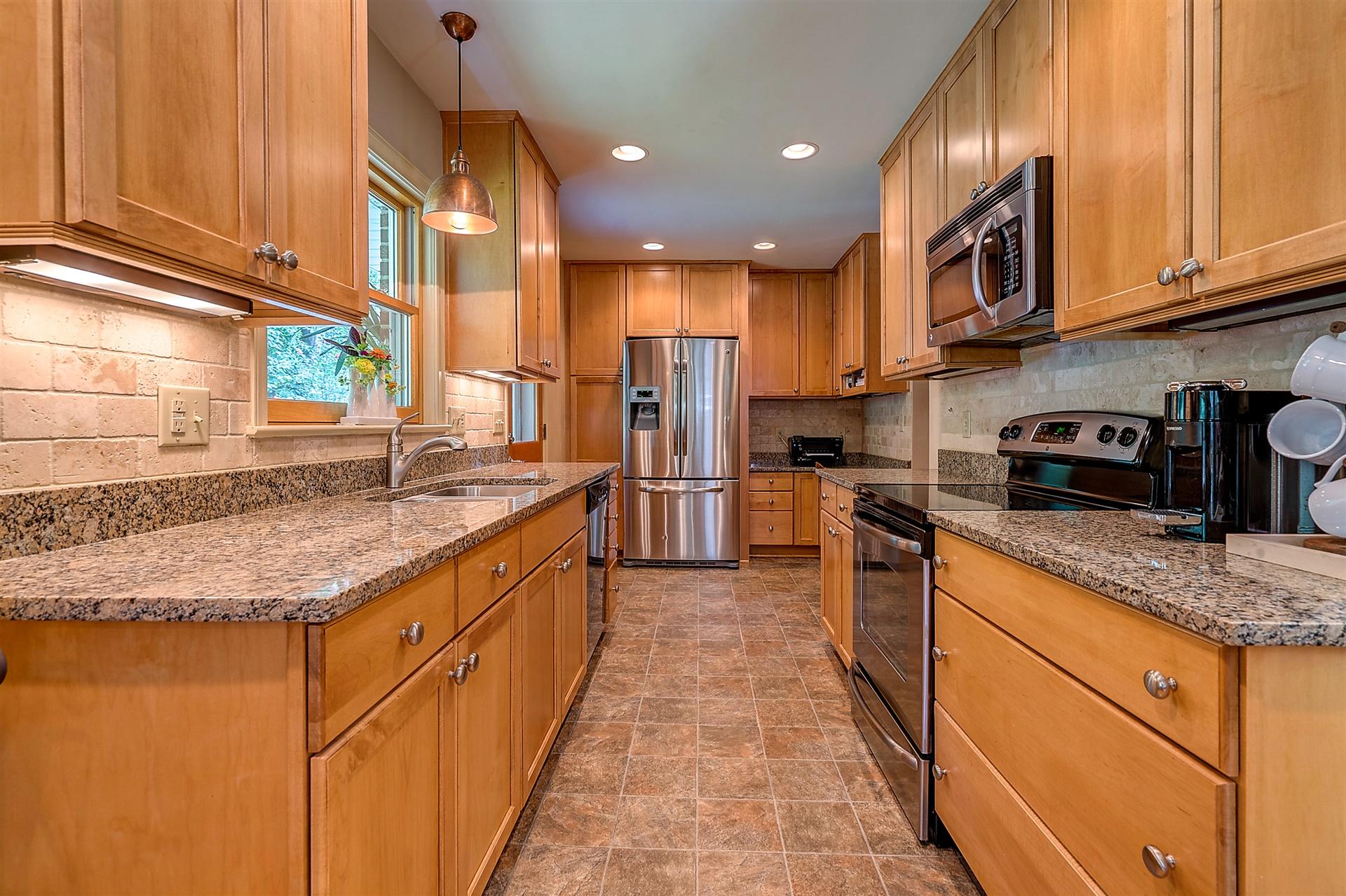 3126 Stoneridge Road Southwest Roanoke, VA 24014 - Photo 17 of 48 a large kitchen with stainless steel appliances granite countertop a sink and cabinets