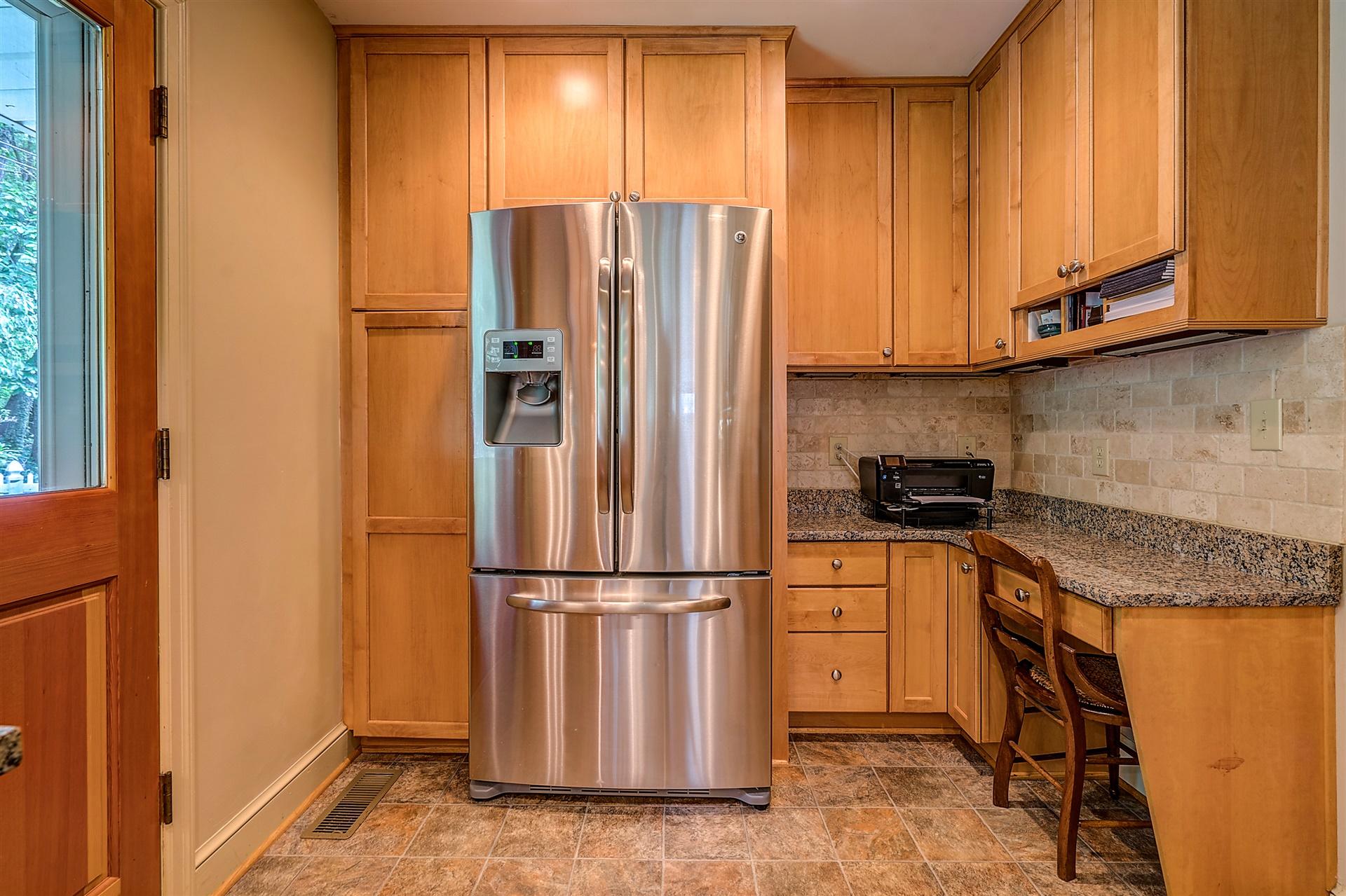 3126 Stoneridge Road Southwest Roanoke, VA 24014 - Photo 19 of 48 a kitchen with stainless steel appliances granite countertop a refrigerator a sink and a stove