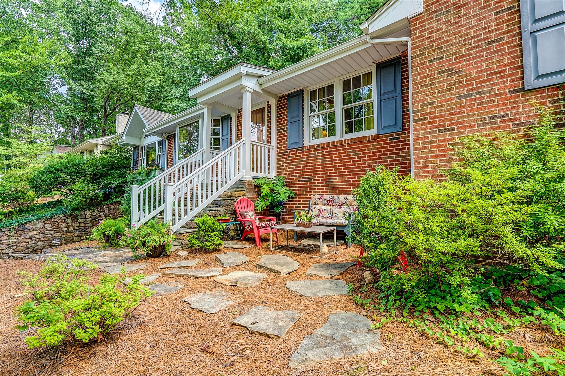 3126 Stoneridge Road Southwest Roanoke, VA 24014 - Photo 3 of 48 a view of backyard with a chair and table and potted plants