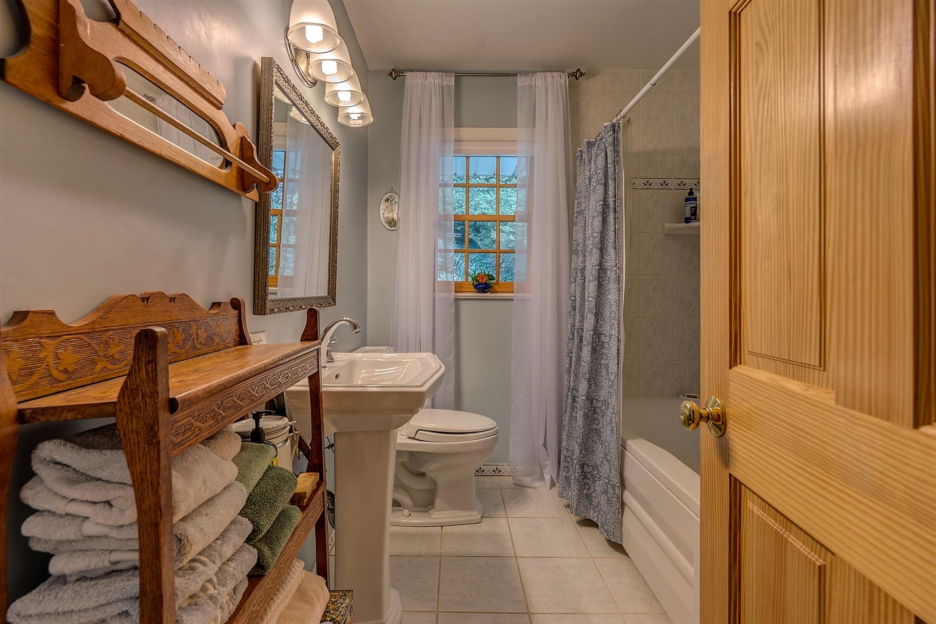 3126 Stoneridge Road Southwest Roanoke, VA 24014 - Photo 21 of 48 a bathroom with a sink a toilet and shower