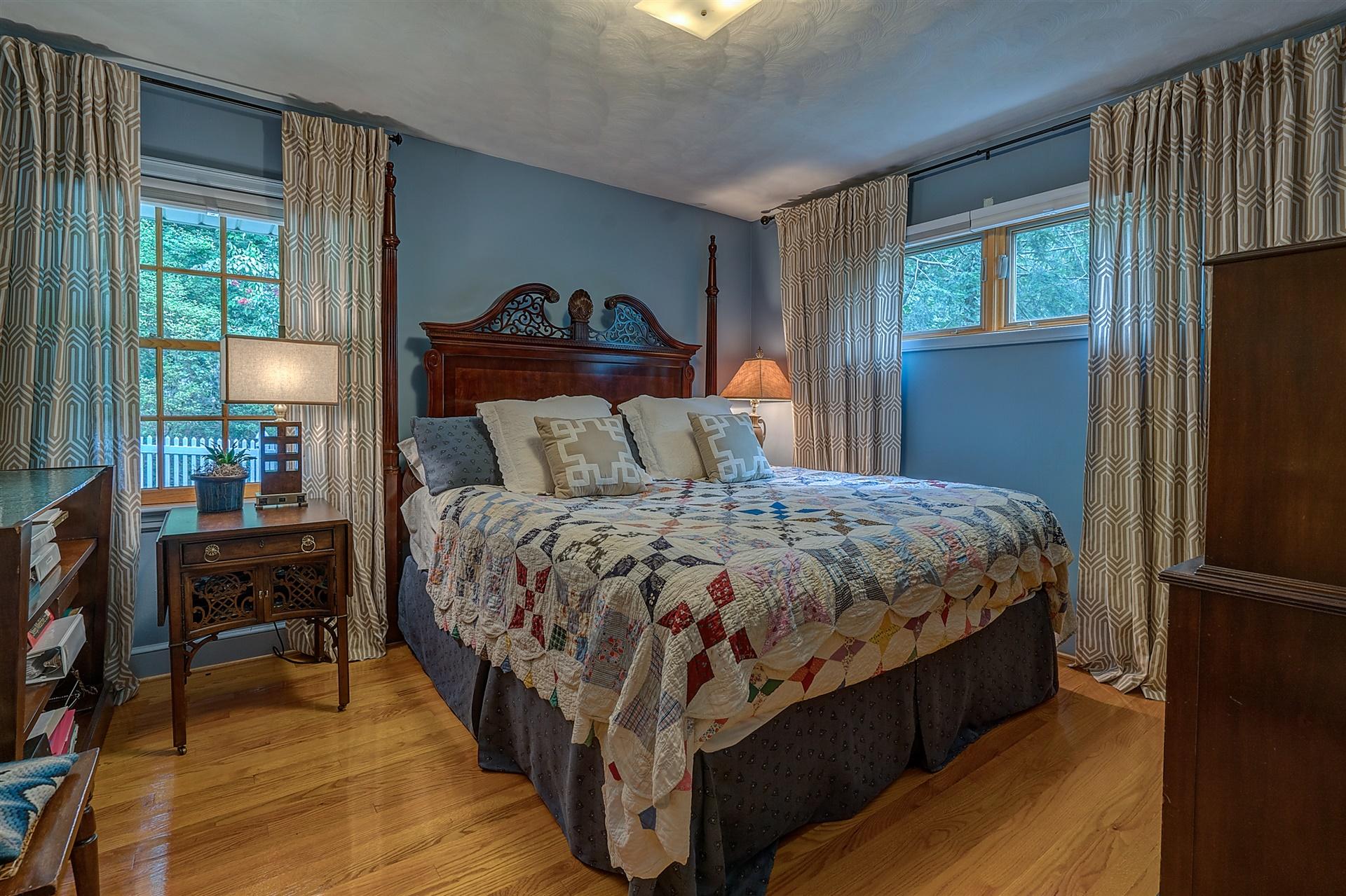 3126 Stoneridge Road Southwest Roanoke, VA 24014 - Photo 30 of 48 a bedroom with a bed and wooden floor