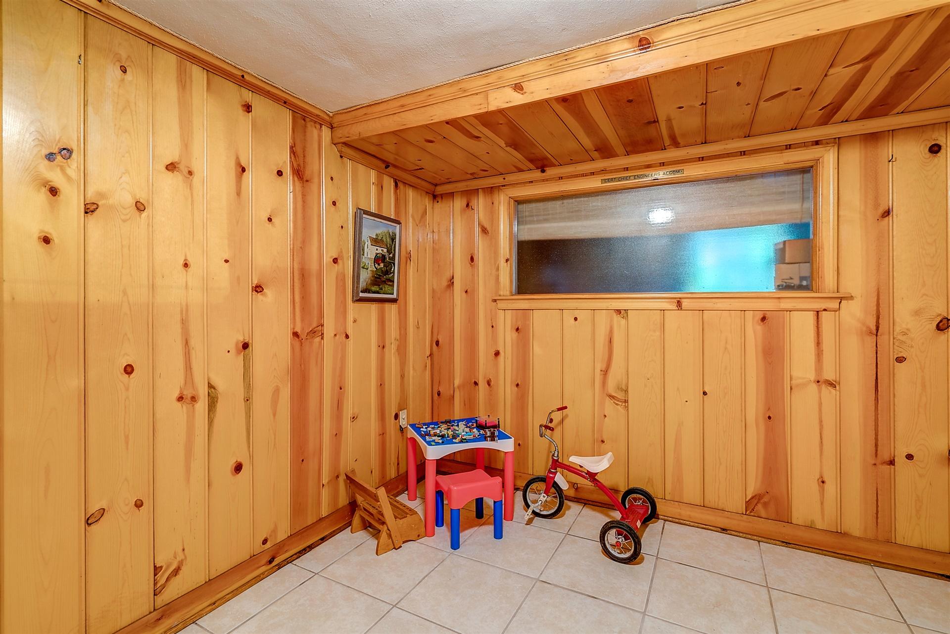 3126 Stoneridge Road Southwest Roanoke, VA 24014 - Photo 37 of 48 a view of a hallway with wooden walls