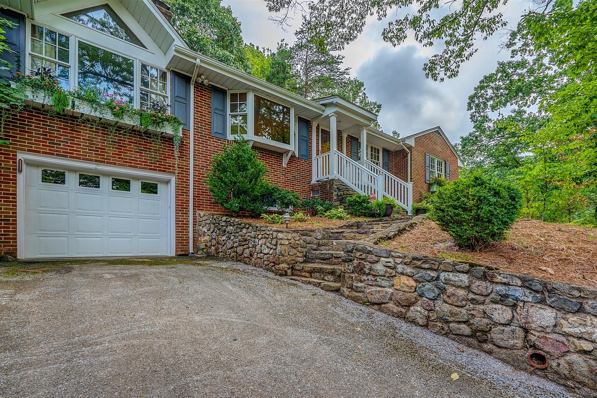 3126 Stoneridge Road Southwest Roanoke, VA 24014 - Photo 45 of 48 a view of a house with a garden