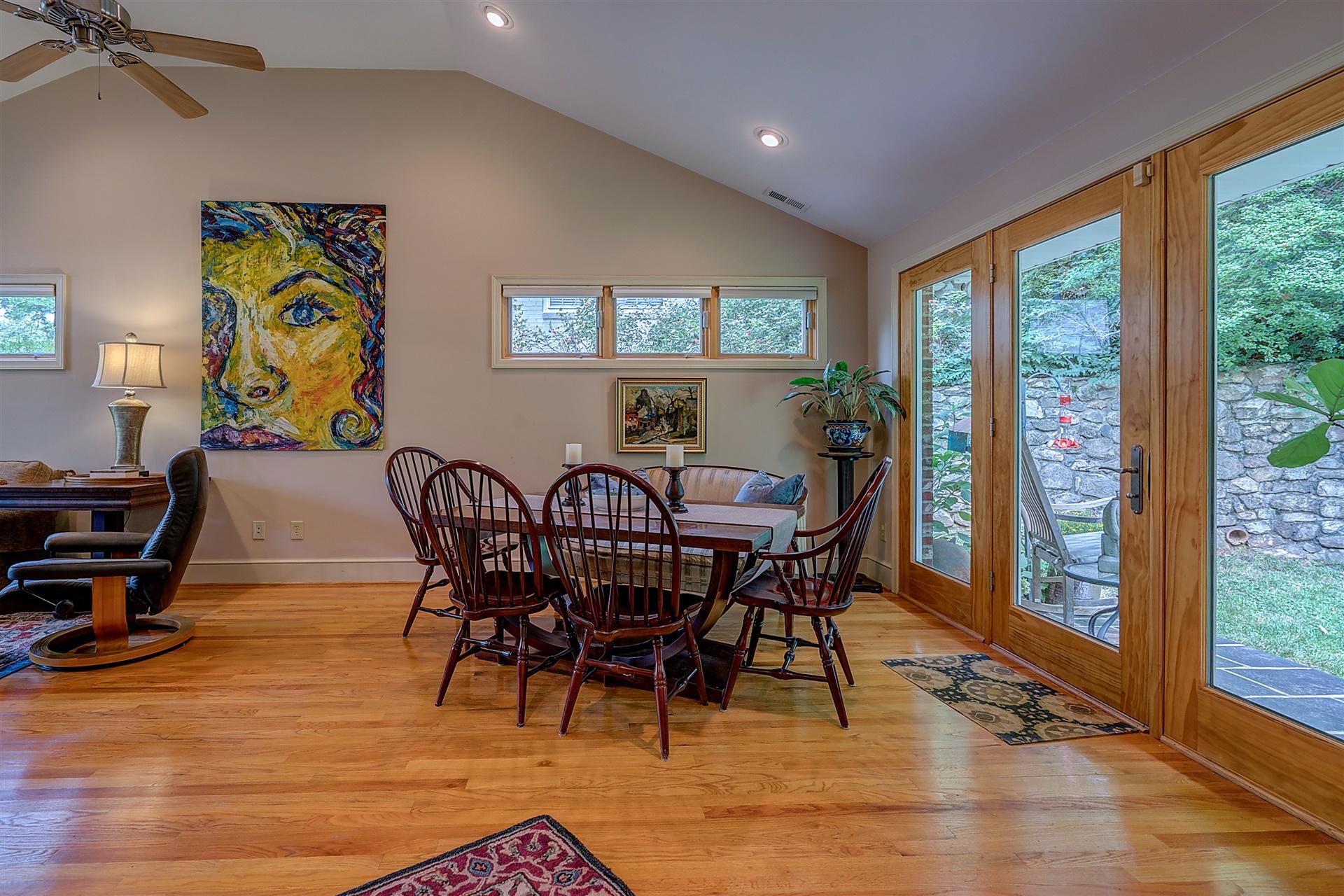 3126 Stoneridge Road Southwest Roanoke, VA 24014 - Photo 10 of 48 a view of a dining room with furniture window and wooden floor