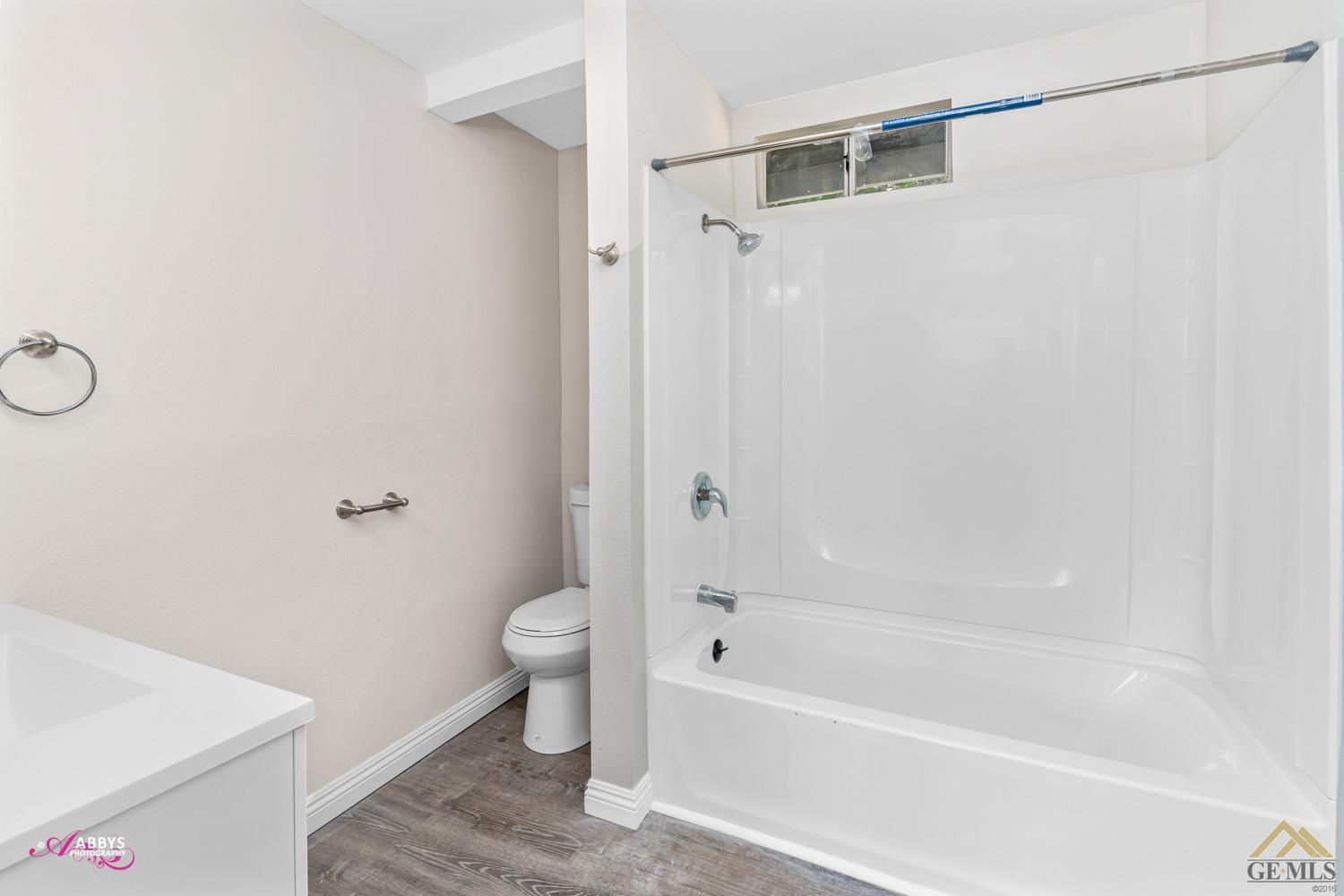 Undisclosed Address Taft, CA 93268 - Photo 14 of 30 a bathroom with a bathtub and a toilet