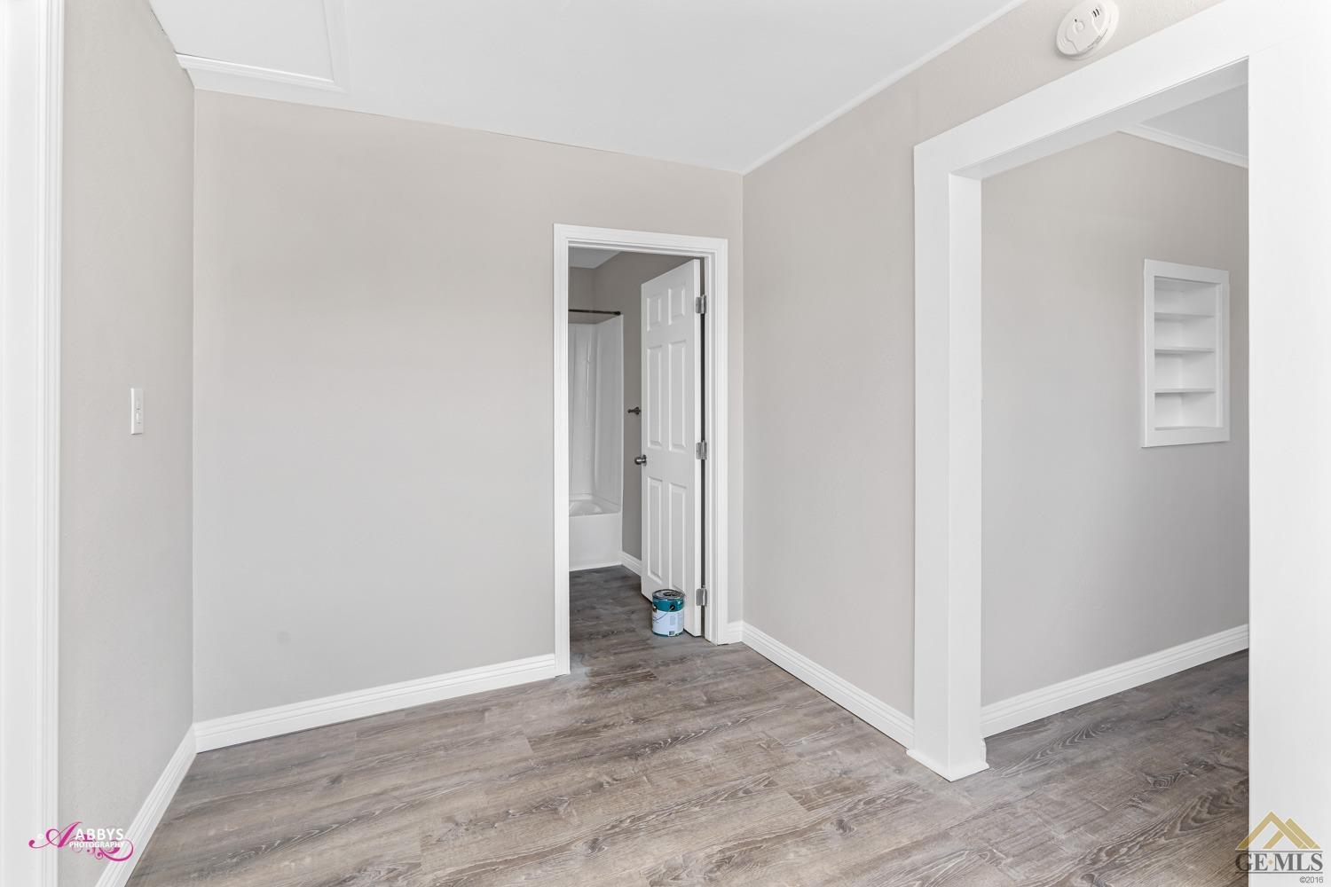 Undisclosed Address Taft, CA 93268 - Photo 18 of 30 a view of an empty room with wooden floor