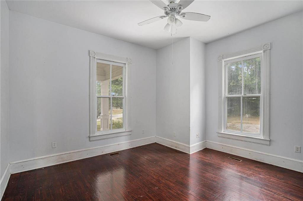 35 Old Mill Road Cedartown, GA 30125 - Photo 19 of 30 a view of an empty room with wooden floor and a window