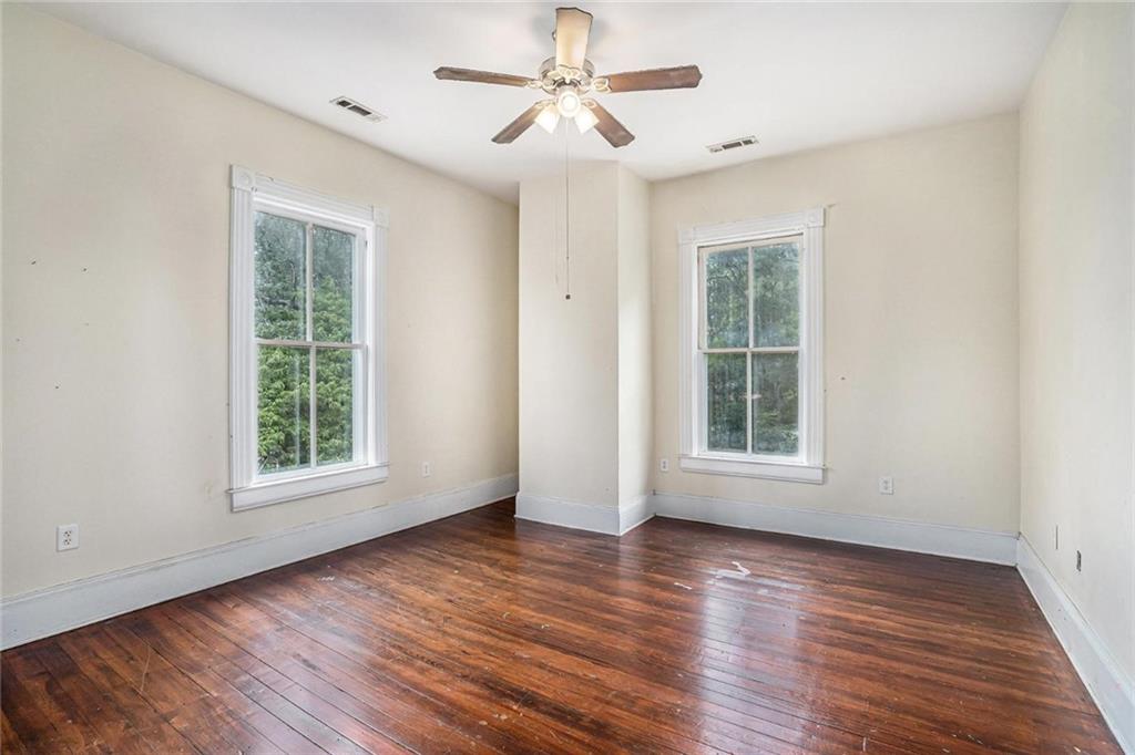 35 Old Mill Road Cedartown, GA 30125 - Photo 24 of 30 a view of an empty room with wooden floor and a window