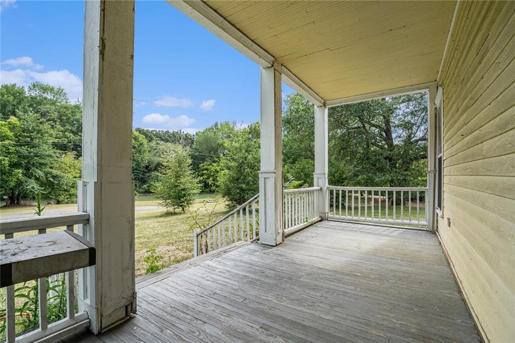 35 Old Mill Road Cedartown, GA 30125 - Photo 6 of 30 a view of a room with wooden floor and wooden fence