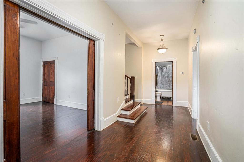 35 Old Mill Road Cedartown, GA 30125 - Photo 8 of 30 a view of a hallway with wooden floor and a bathroom