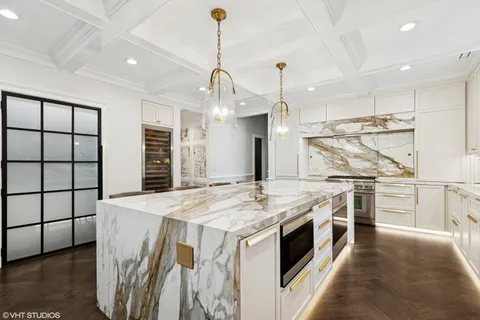a kitchen with stainless steel appliances a sink and a window