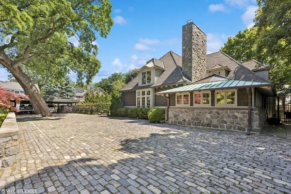 an aerial view of a house with swimming pool patio and outdoor seating