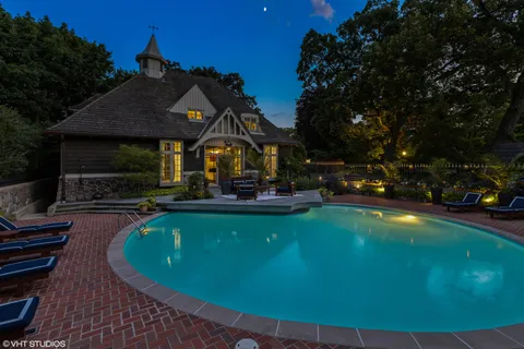 a view of house with outdoor space and seating