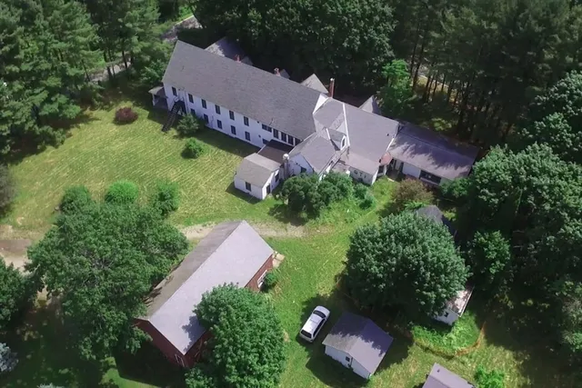 a backyard of a house with lots of green space